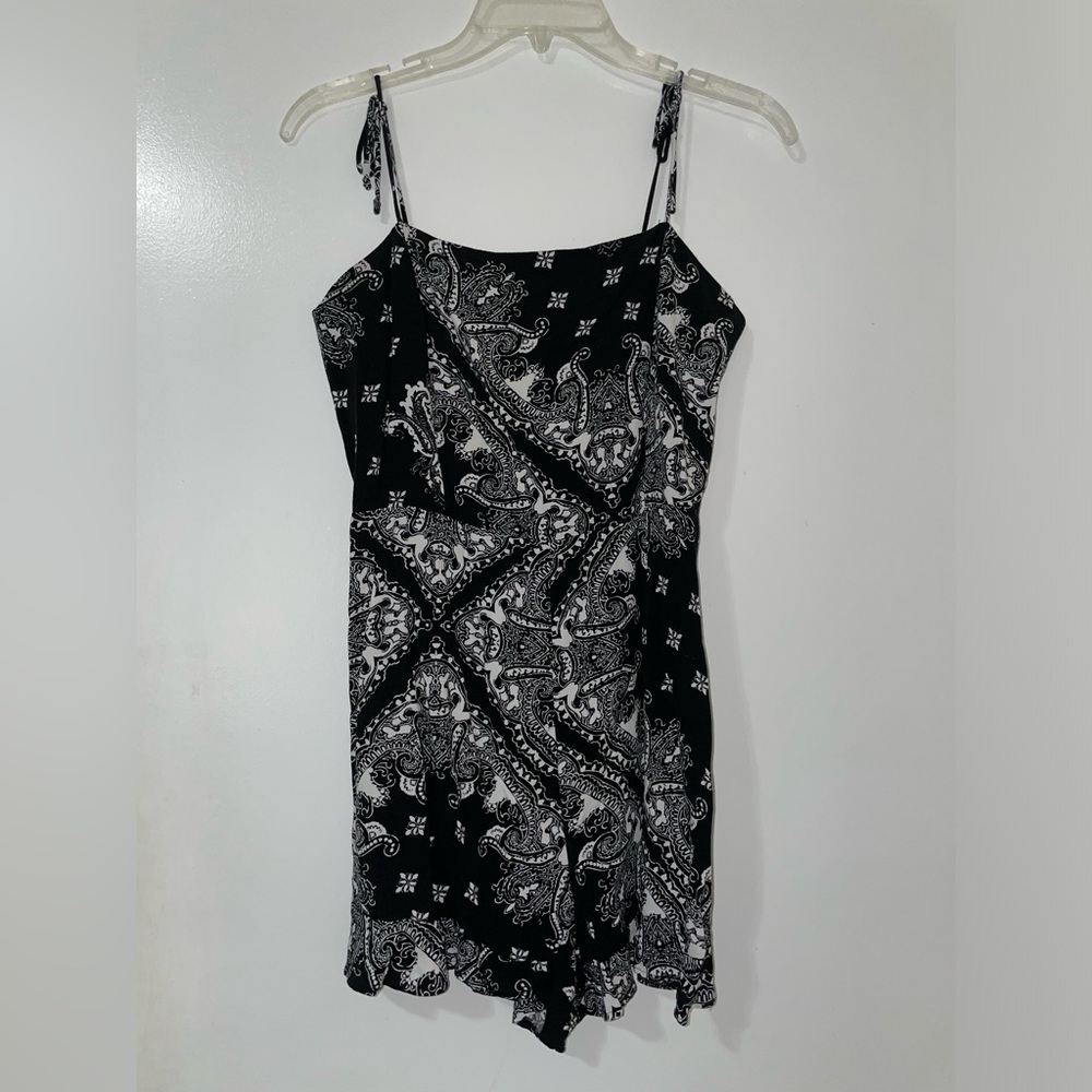 Black and white paisley print romper with adjustable straps and side zipper